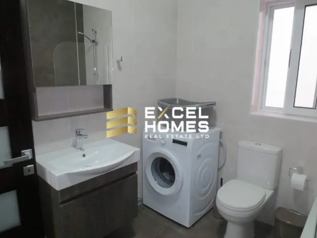 a white toilet sitting next to a white sink