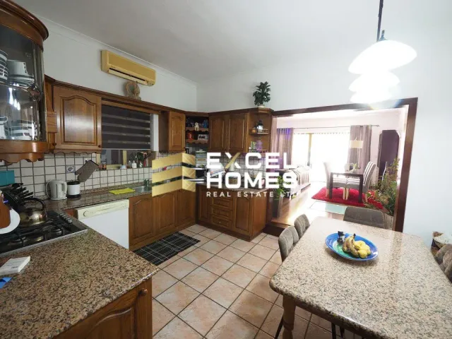 a kitchen with a sink, stove, and cabinets 