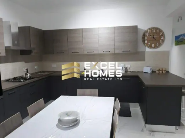 a kitchen with a white counter top and a black counter top