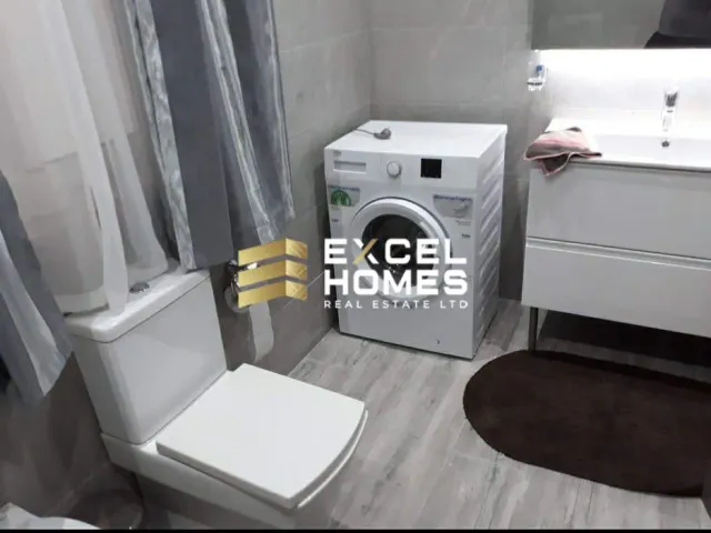 a white toilet sitting next to a white sink
