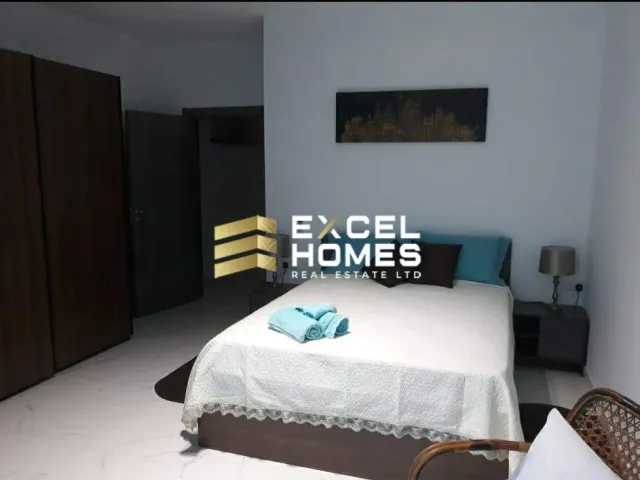 a bed with a white bedspread and a white bedspread