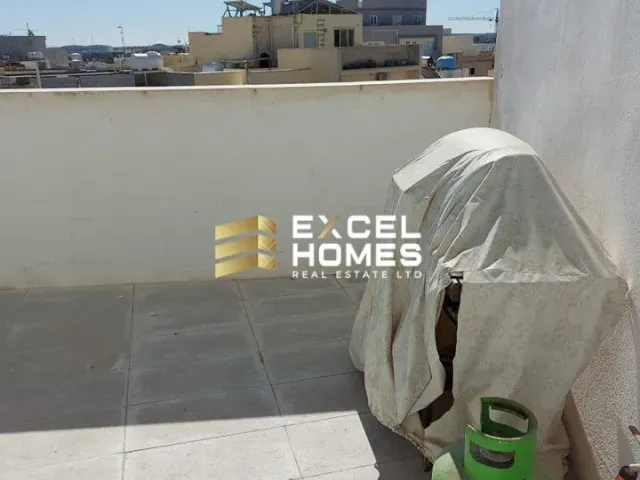 a white umbrella sitting on a ledge