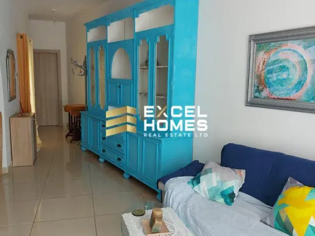 a blue room with a blue bed and blue walls