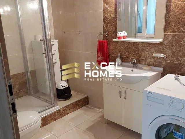 a bathroom with a sink, toilet and a shower