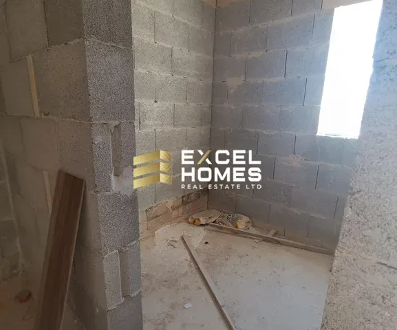 a wall with a broken window and a brick wall