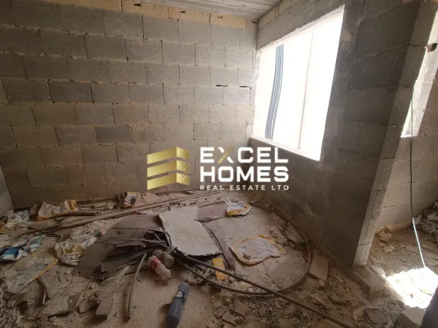 a broken down building with a broken wall