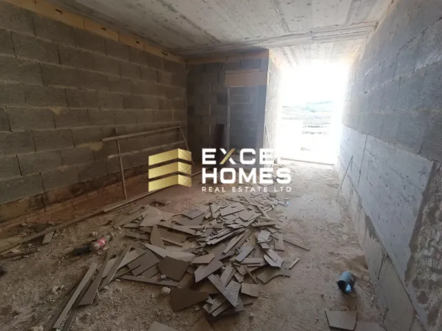 a room with a wall of bricks and a wall of bricks