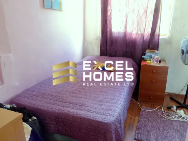 a bed with a blue blanket and a blue comforter