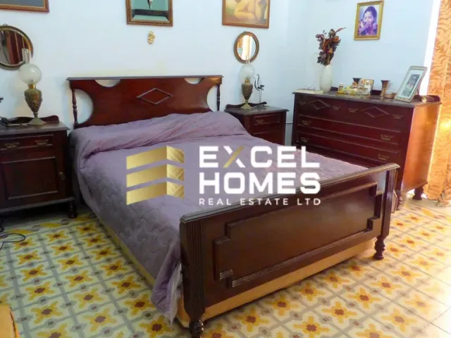 a bed with a large bedspread and a large bedspread