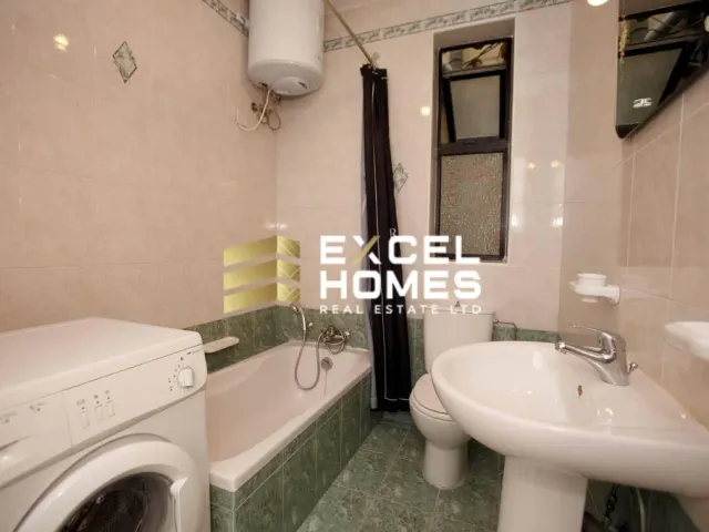 a bathroom with a sink, toilet and bathtub