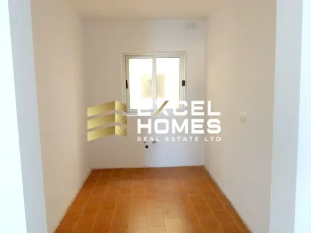 a room with a wall with a door open 
