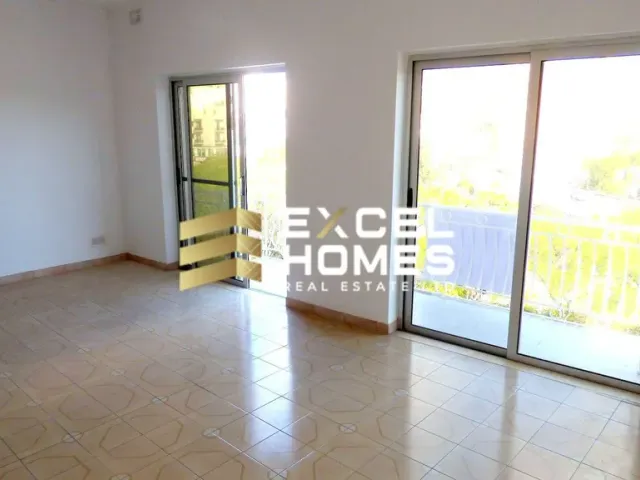 a room with a door open and a window 