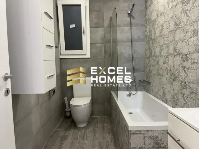 a bathroom with a toilet, sink, and tub