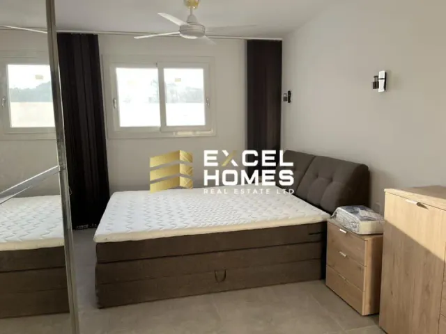 a bed with a white bedspread and a white bedspread
