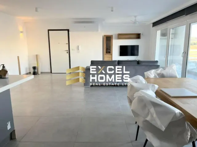 a large room with a large window and a large table