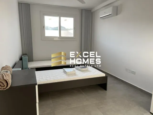 a bathroom with a sink, toilet and a window