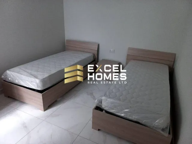 a bed with a bedspread and a pillow on it