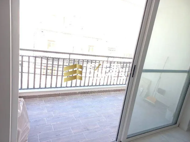 a window with a toilet and a tub