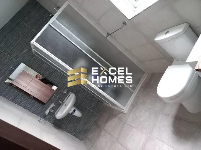 a bathroom with a toilet and a sink