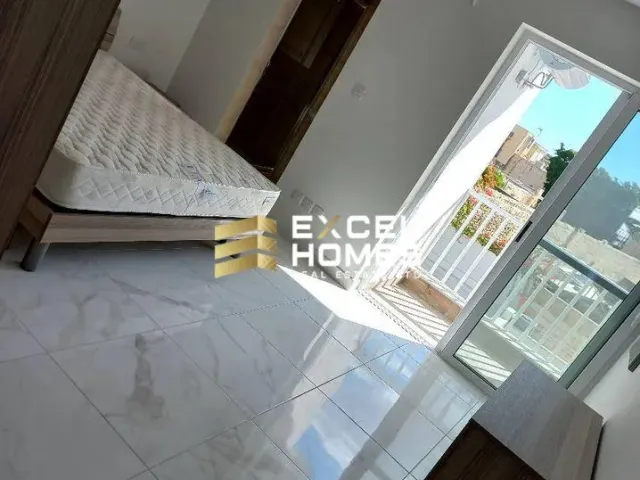 a bed in a room with a window