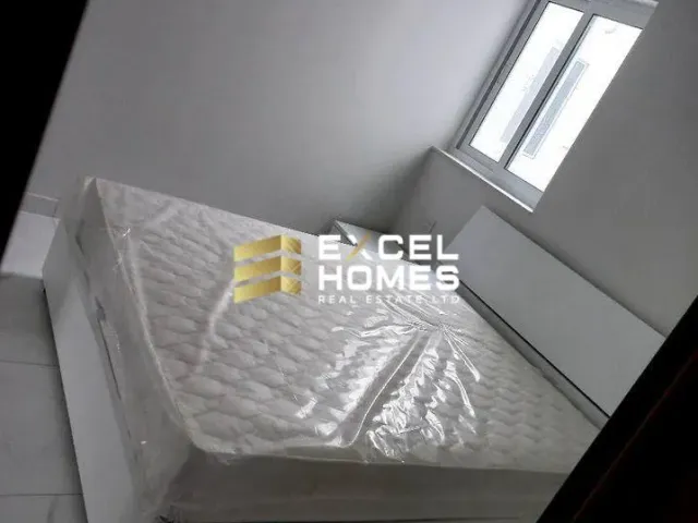 a bed with a pillow and a blanket on it