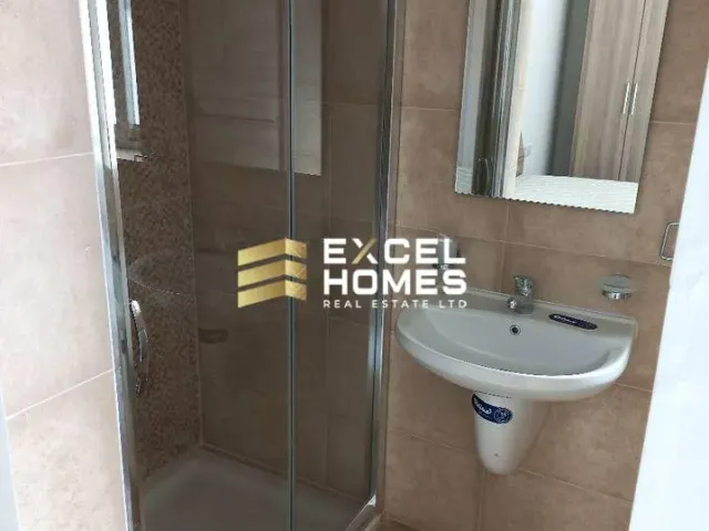 a bathroom with a shower, sink, and toilet