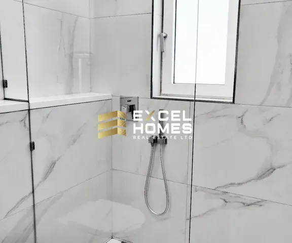 a bathroom with a mirror and a bath tub