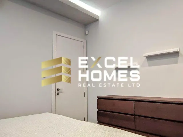 a bedroom with a bed, lamp, and a wall mounted wall mounted wall mounted wall mounted wall mounted wall mounted wall mounted wall mounted wall mounted wall mounted wall mounted wall mounted wall mounted wall mounted wall mounted wall mounted wall mounted wall mounted wall mounted wall mounted