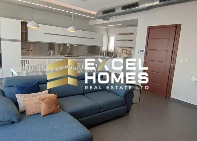 a living room with a couch, coffee table and a television