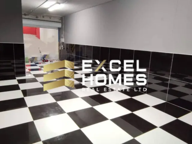 a room with a large white teddy bear on the floor