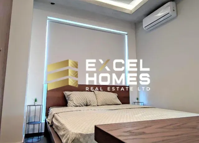 a bed with a white bedspread and a white bedspread