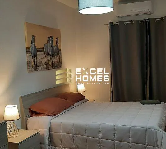 a bed with a night stand and a lamp