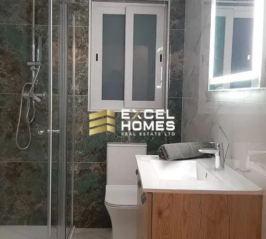 a bathroom with a shower, sink, and tub