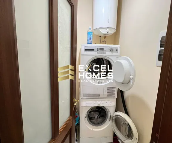 a toilet with a remote control and a picture of a man