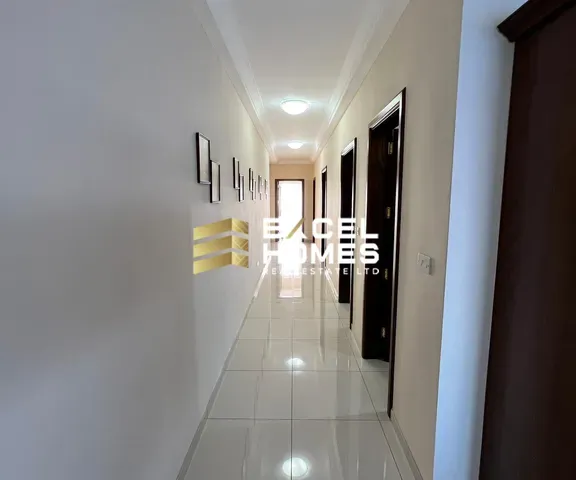 a hallway with a door and a wall with a door