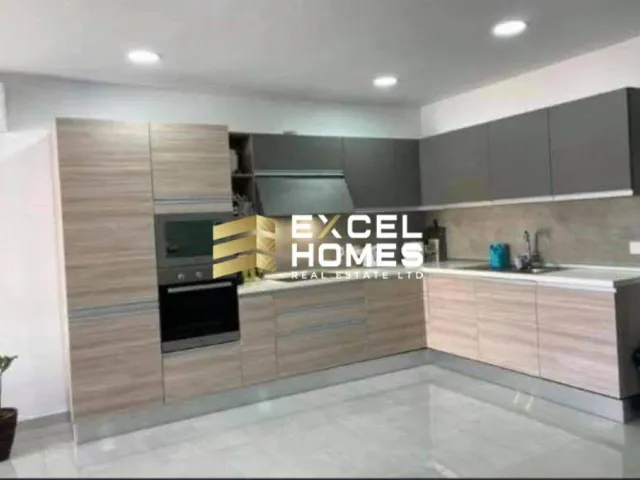 a kitchen with a stove, sink, and cabinets 