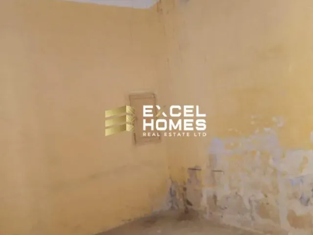 a wall with a graffiti covered wall and a light