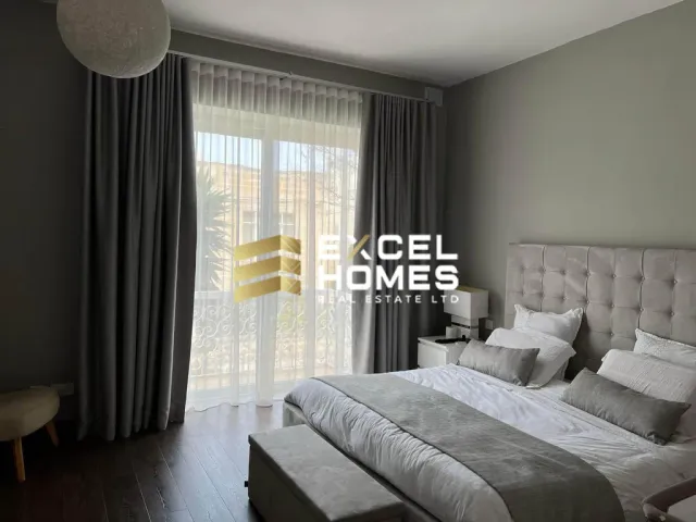 a bed with a white comforter and a white comforter on a white bed 