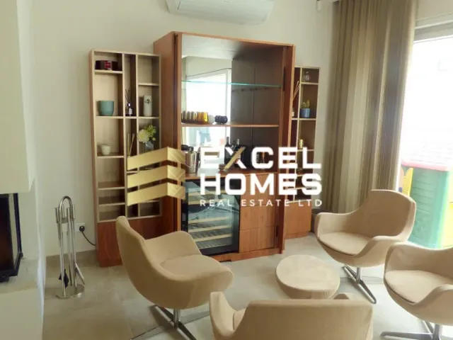 a living room with a chair and a table 