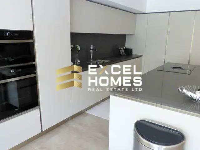 a kitchen with a sink, stove, microwave and refrigerator 