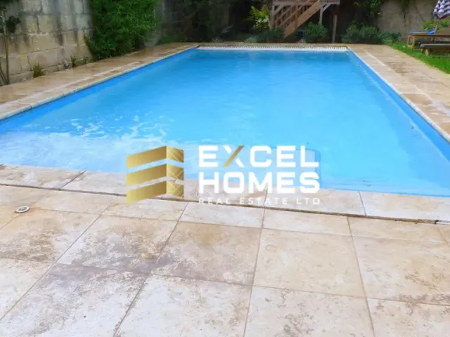 a blue pool with a blue surfboard on top of it 