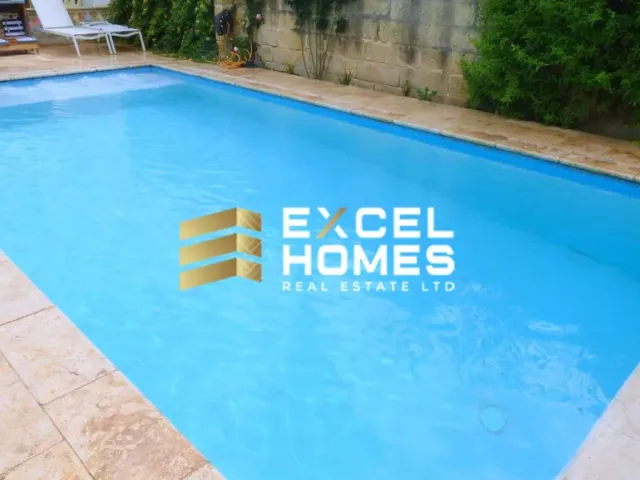 a blue and white swimming pool with a blue surfboard 