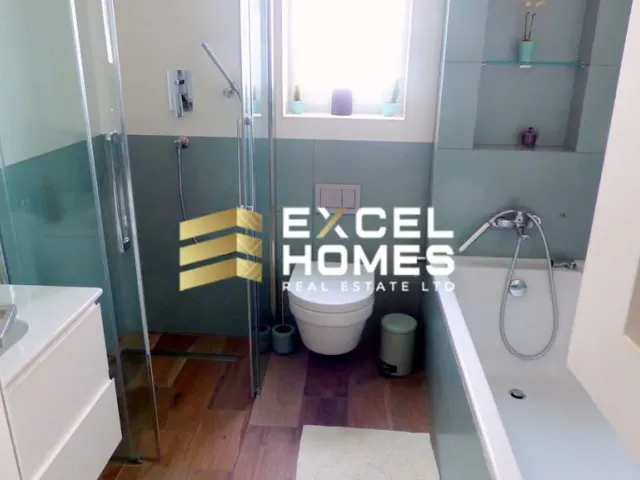 a bathroom with a toilet, sink, and shower 