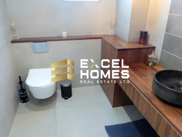 a bathroom with a toilet and a sink 