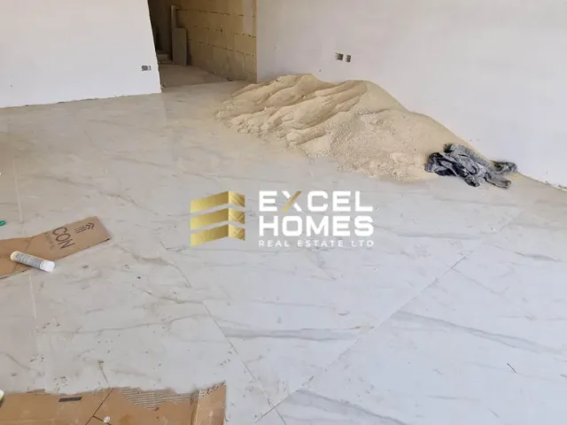 a pile of junk on the ground with a broken wall