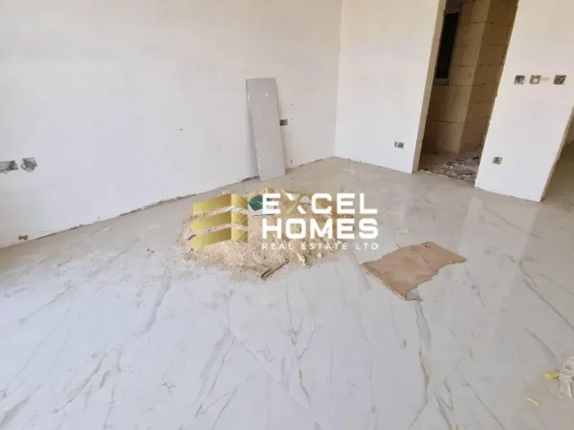 a white bed with a white sheet on it