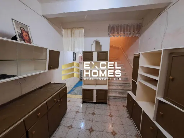 a kitchen with a large window and a large counter