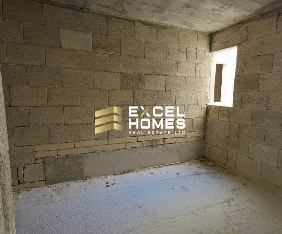 a wall with a graffiti covered wall and a toilet