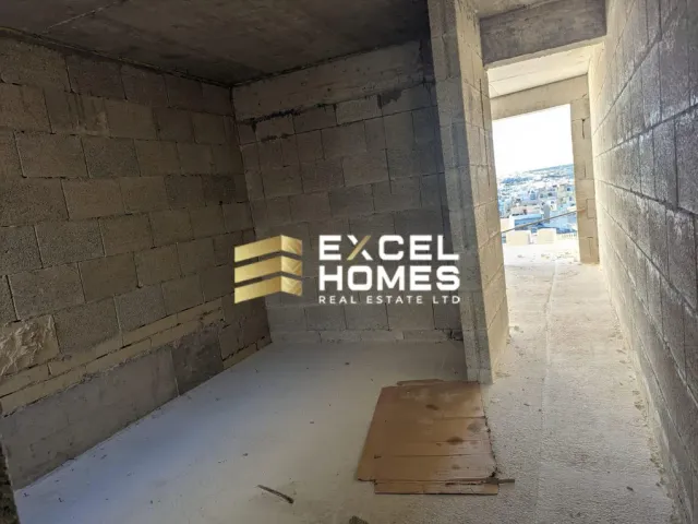 a wall with a broken down door and a pile of rubble