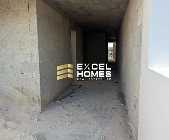 a wall with a graffiti covered wall and a door